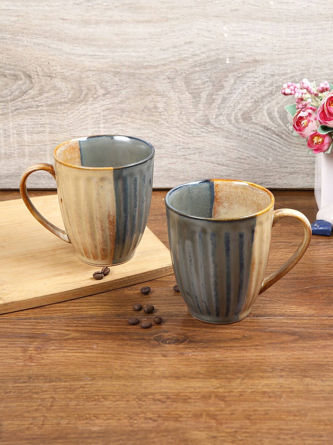 

Aapno Rajasthan Set of 2 Grey & Beige Textured Ceramic Glossy Mugs