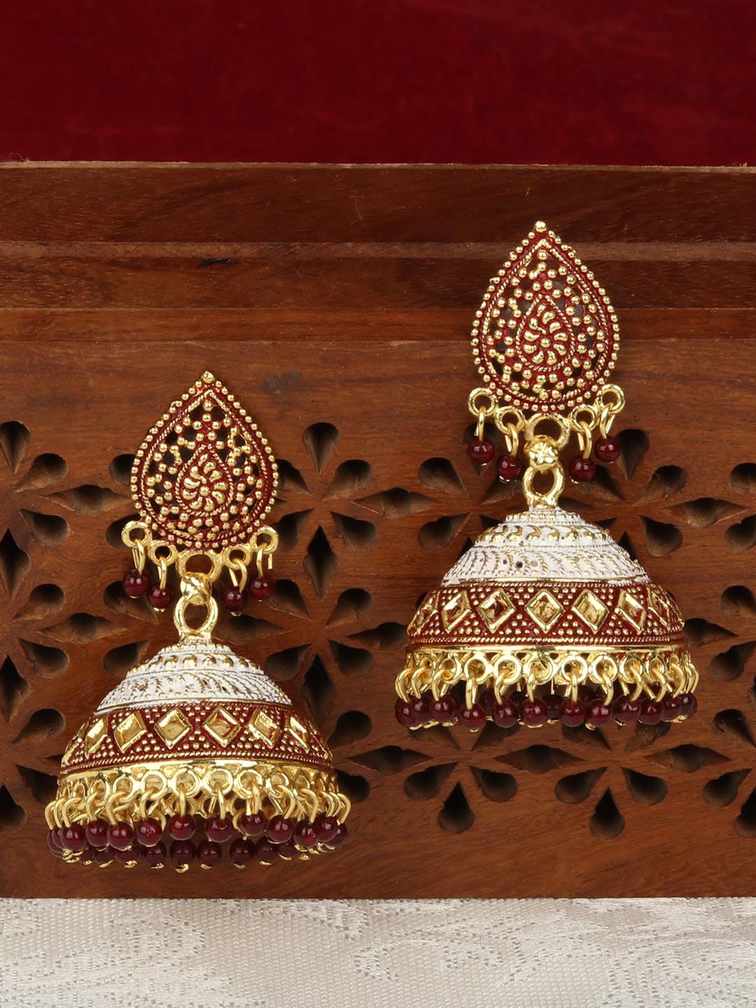 

ANIKAS CREATION Gold-Toned & Maroon Dome Shaped Jhumkas Earrings