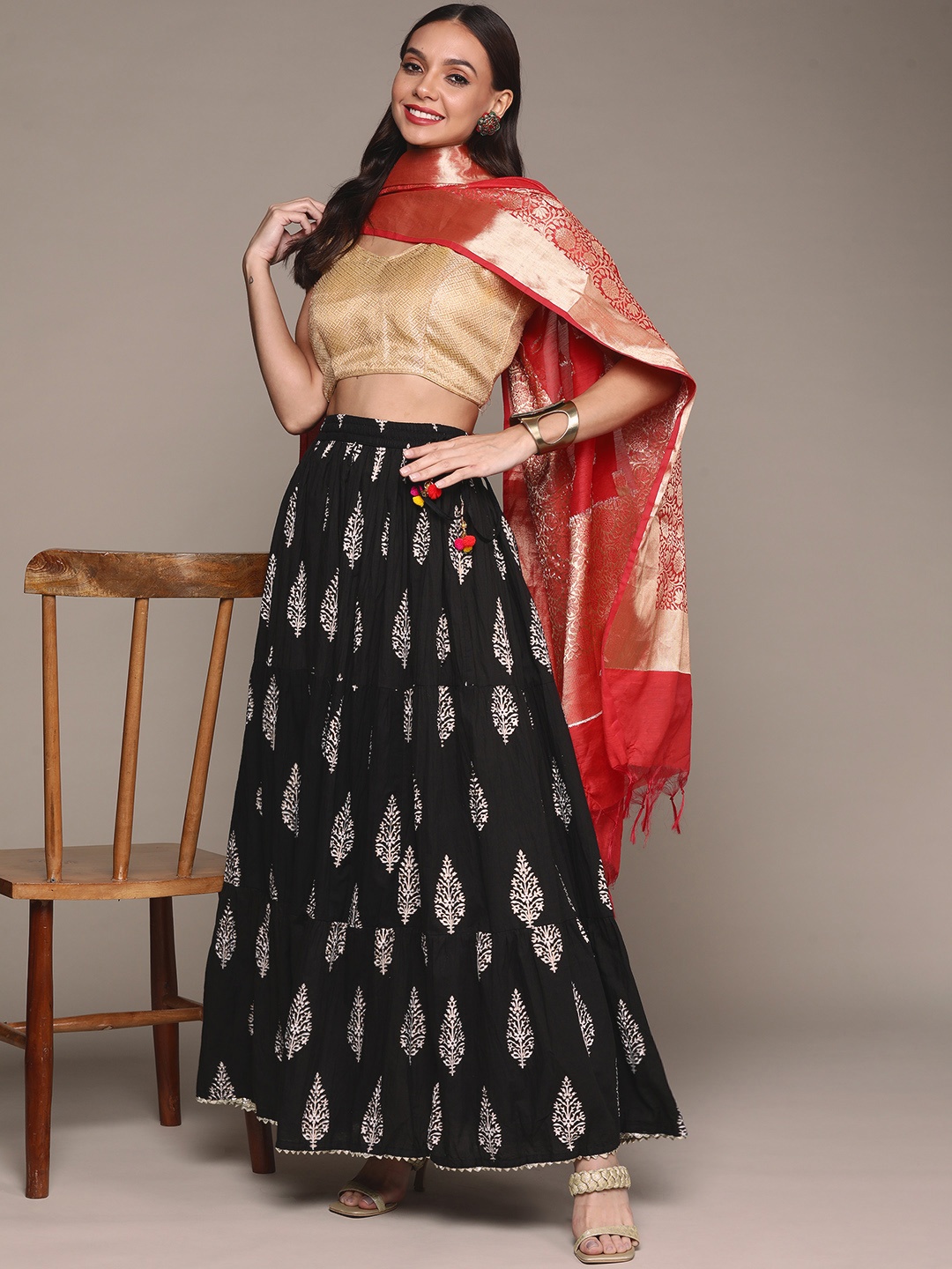 

Ishin Women Black & Gold Floral Foil Print Gotta Patti Hem Cotton Flared Maxi Skirt