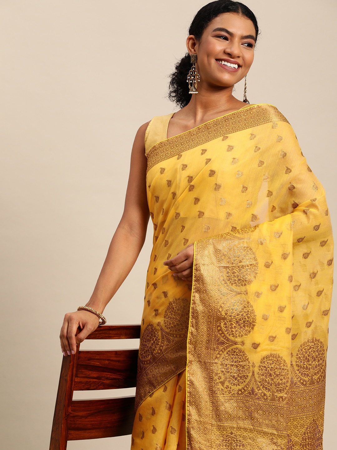 

Leeza Store Yellow & Golden Ethnic Motifs Zari Banarasi Saree