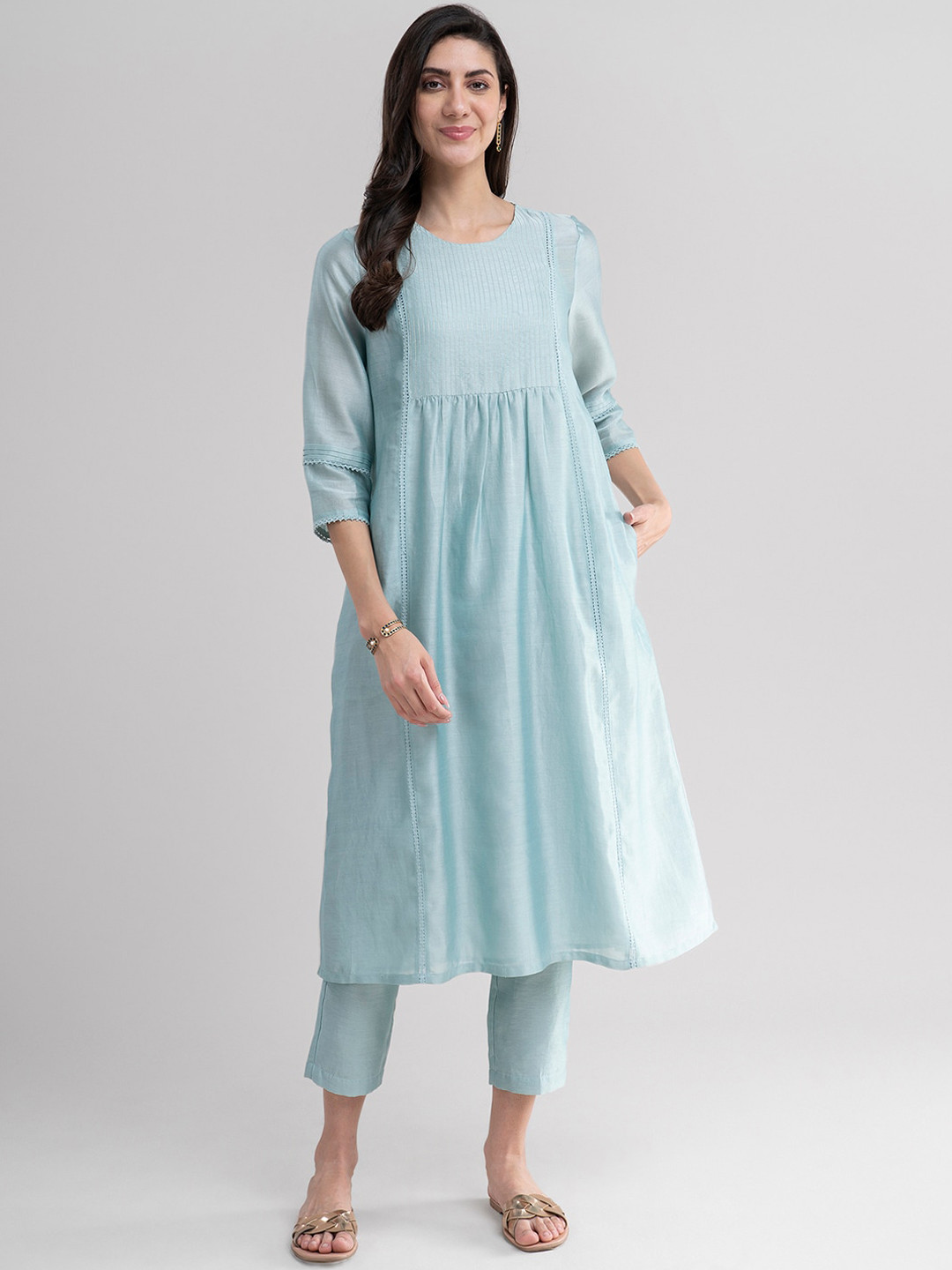 

Pink Fort Women Sea Green Empire Thread Work Kurti with Trousers