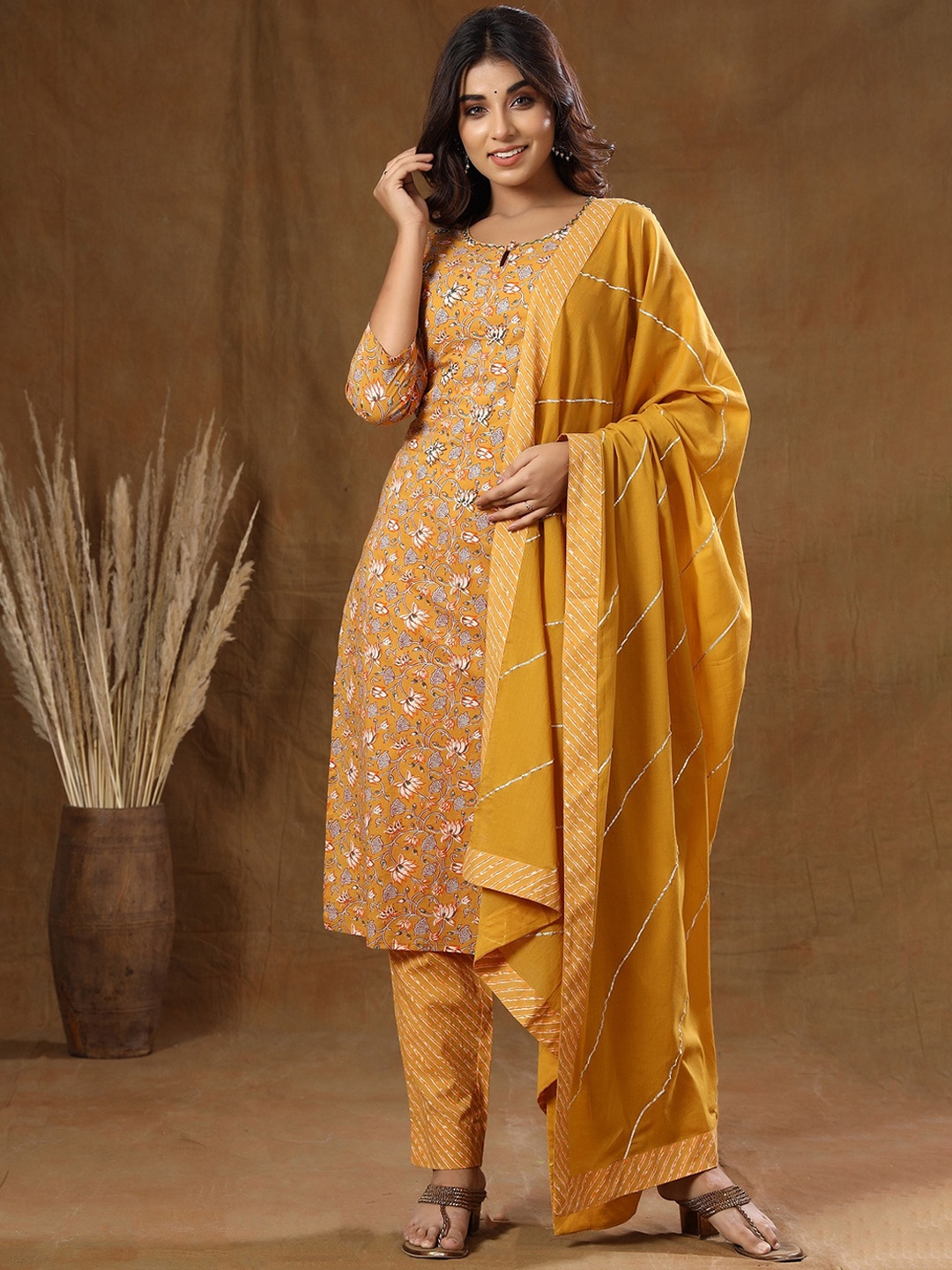 

KAAJH Women Mustard Yellow Floral Printed Pure Cotton Kurta with Trousers & With Dupatta