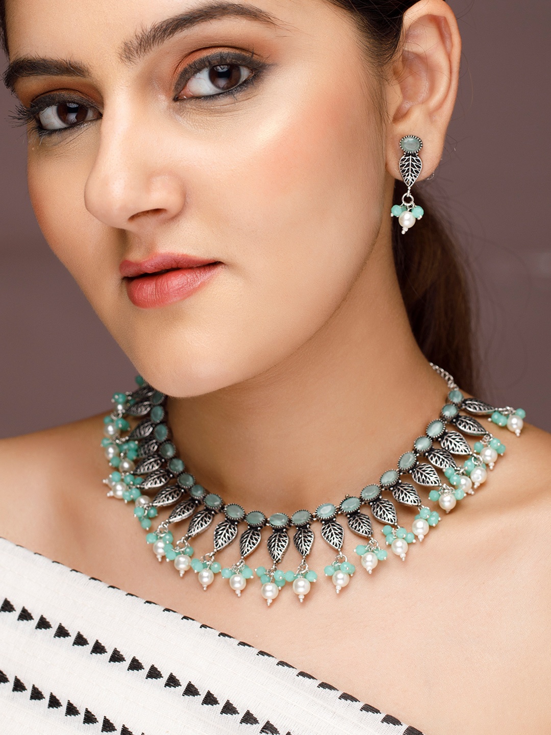 

Rubans Silver-Plated & Green Stone Studded & Beaded Jewellery Set
