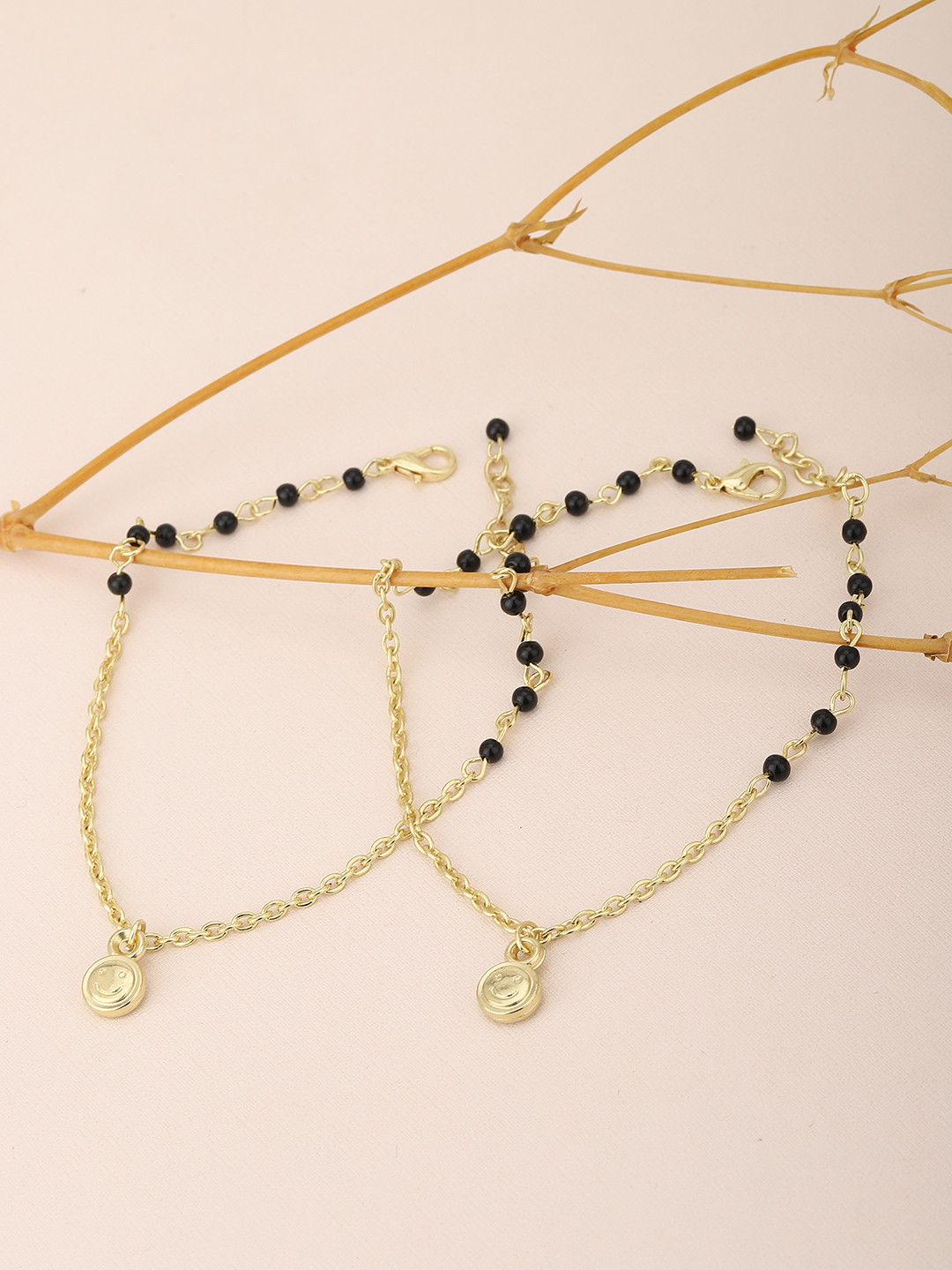 

Carlton London Women Pair of Black & Gold Plated Anklet