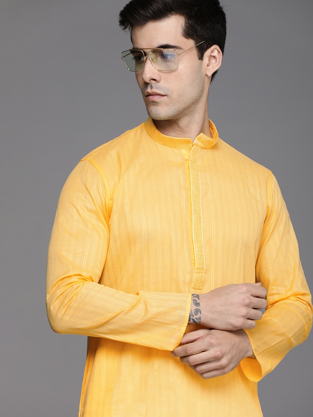 

Manyavar Men Yellow Striped Gotta Patti Kurta with Pyjamas