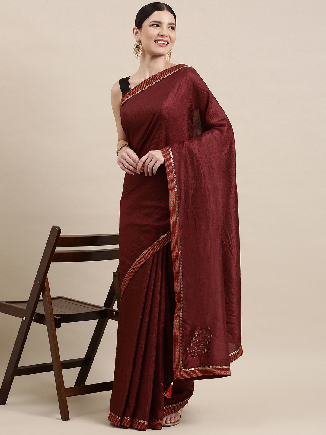 

Indian Women Maroon & Beige Zari Silk Blend Saree