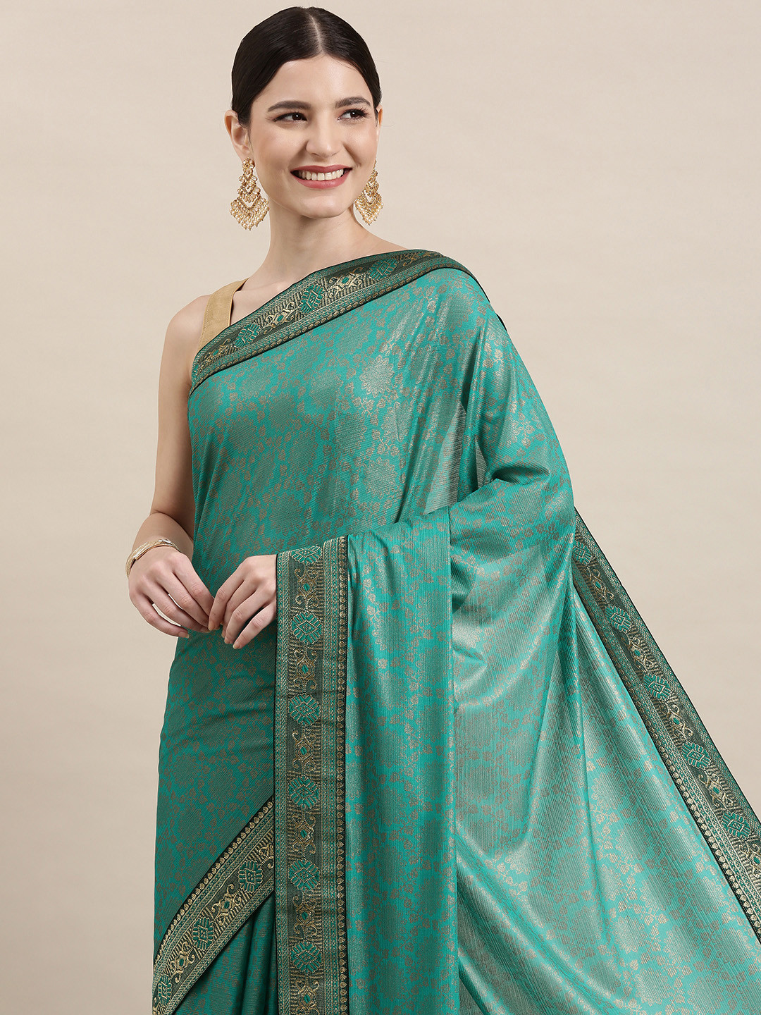 

Indian Women Turquoise Blue & Golden Ethnic Motifs Zari Silk Blend Saree