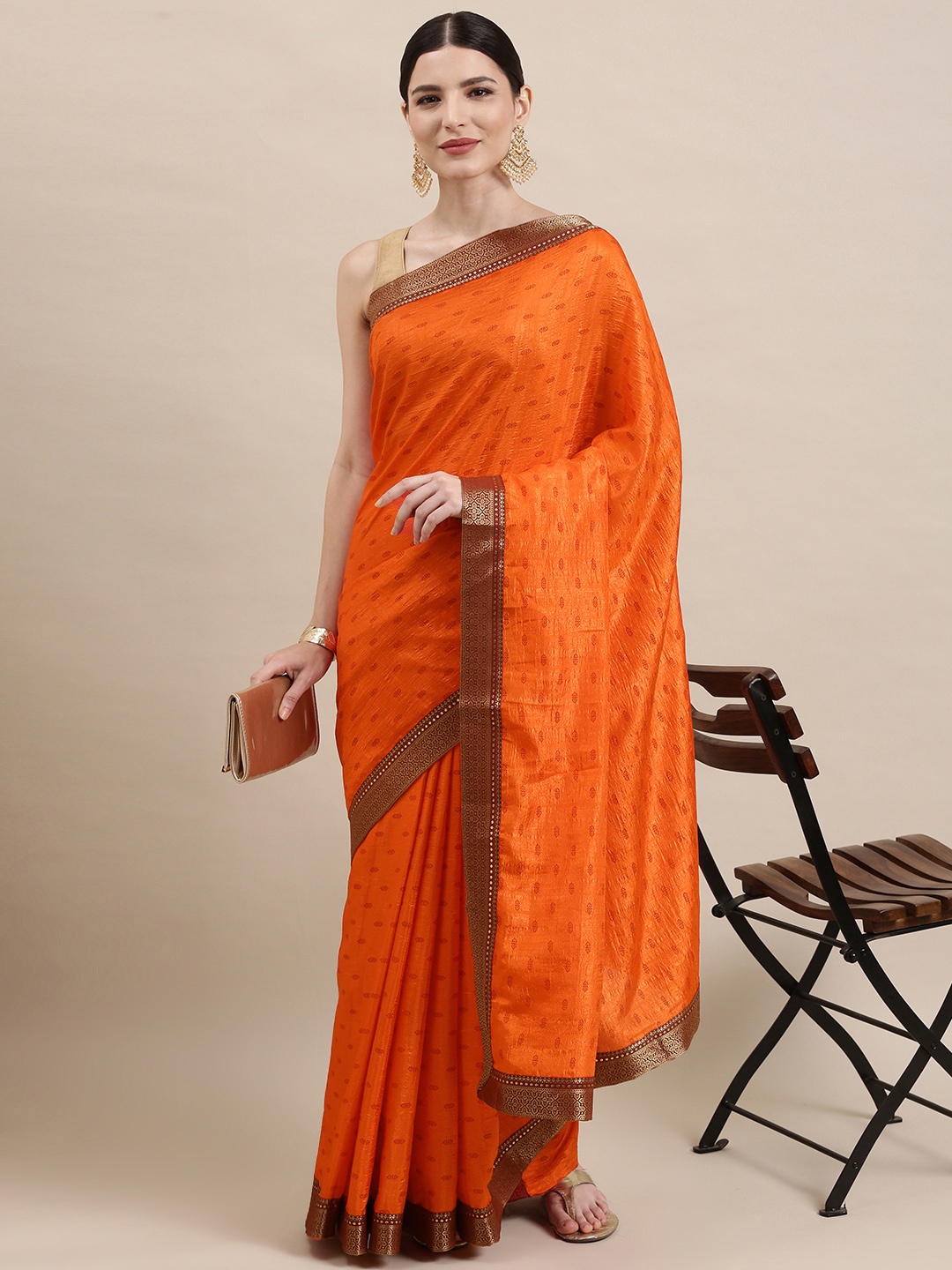 

Indian Women Orange & Beige Ethnic Motifs Zari Silk Blend Saree