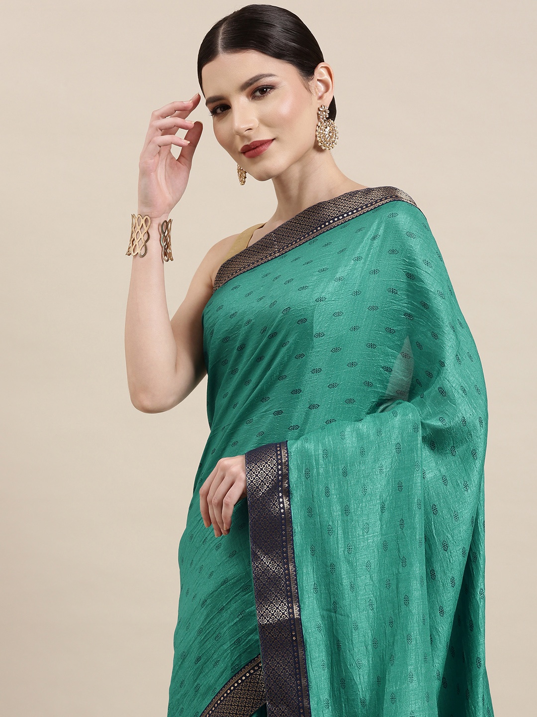 

Indian Women Teal Green & Navy Blue Ethnic Motifs Zari Silk Blend Saree