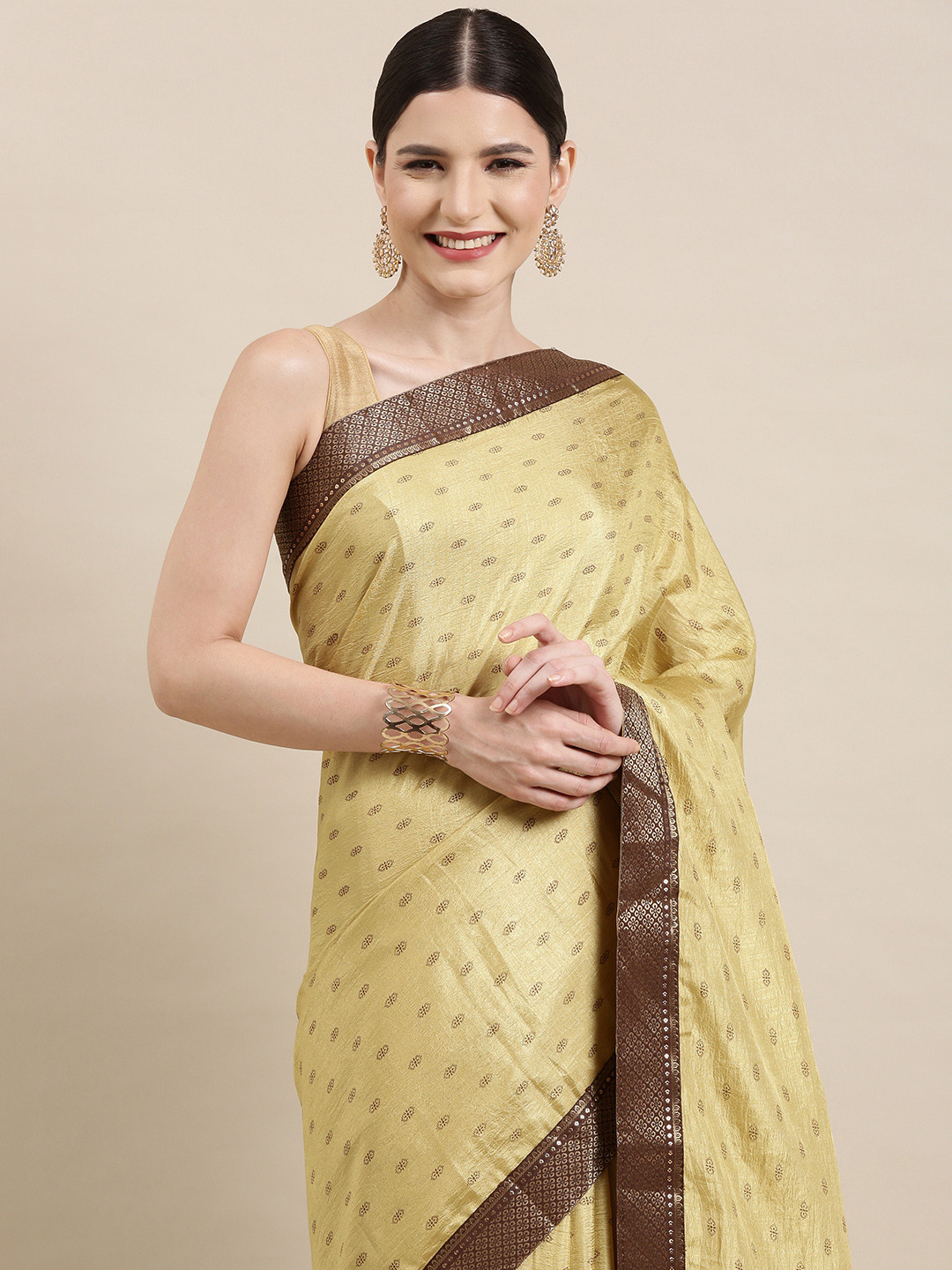 

Indian Women Cream-Coloured & Coffee Brown Ethnic Motifs Zari Silk Blend Saree