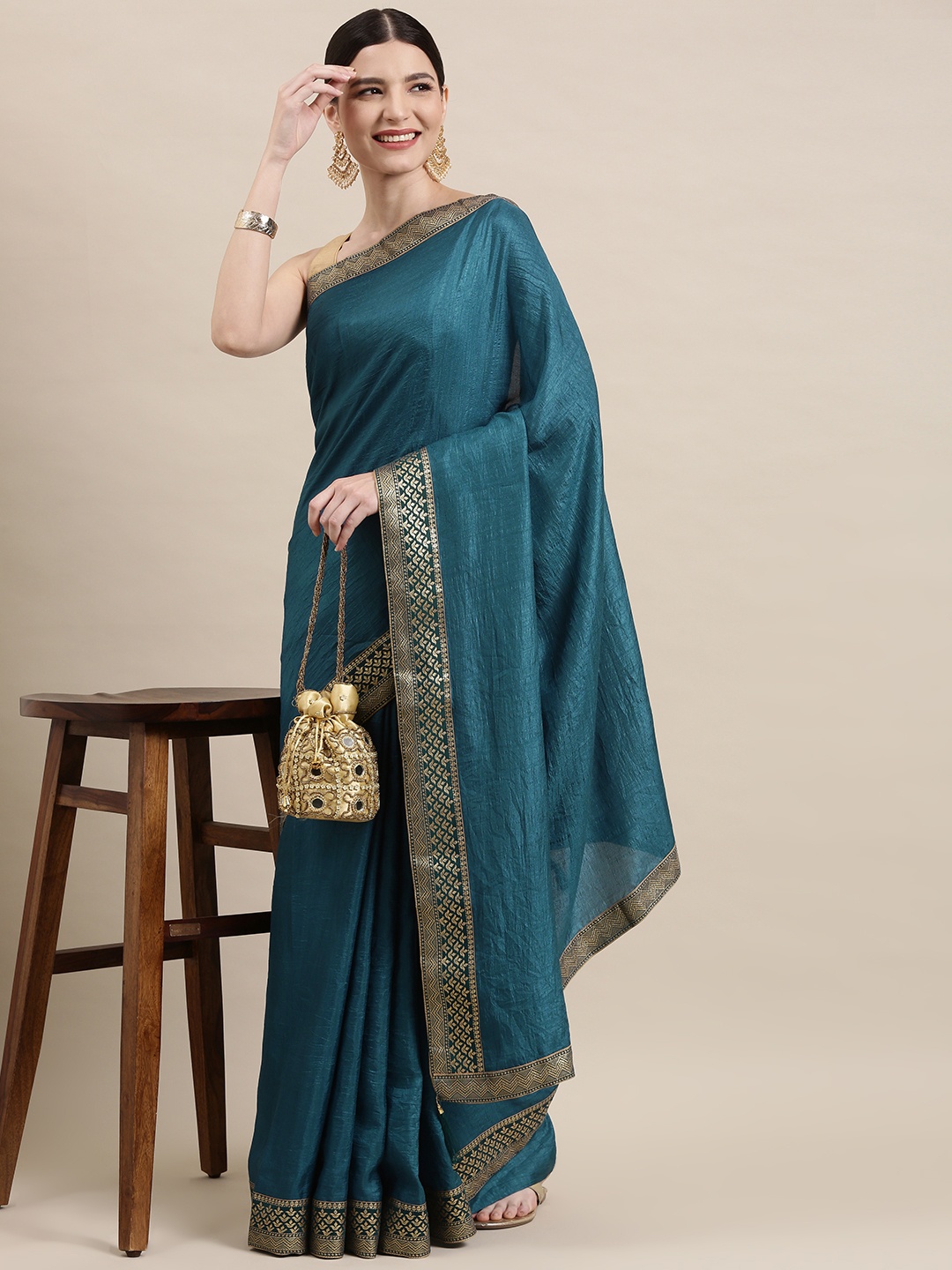 

Indian Women Teal Blue & Silver Zari Silk Blend Saree
