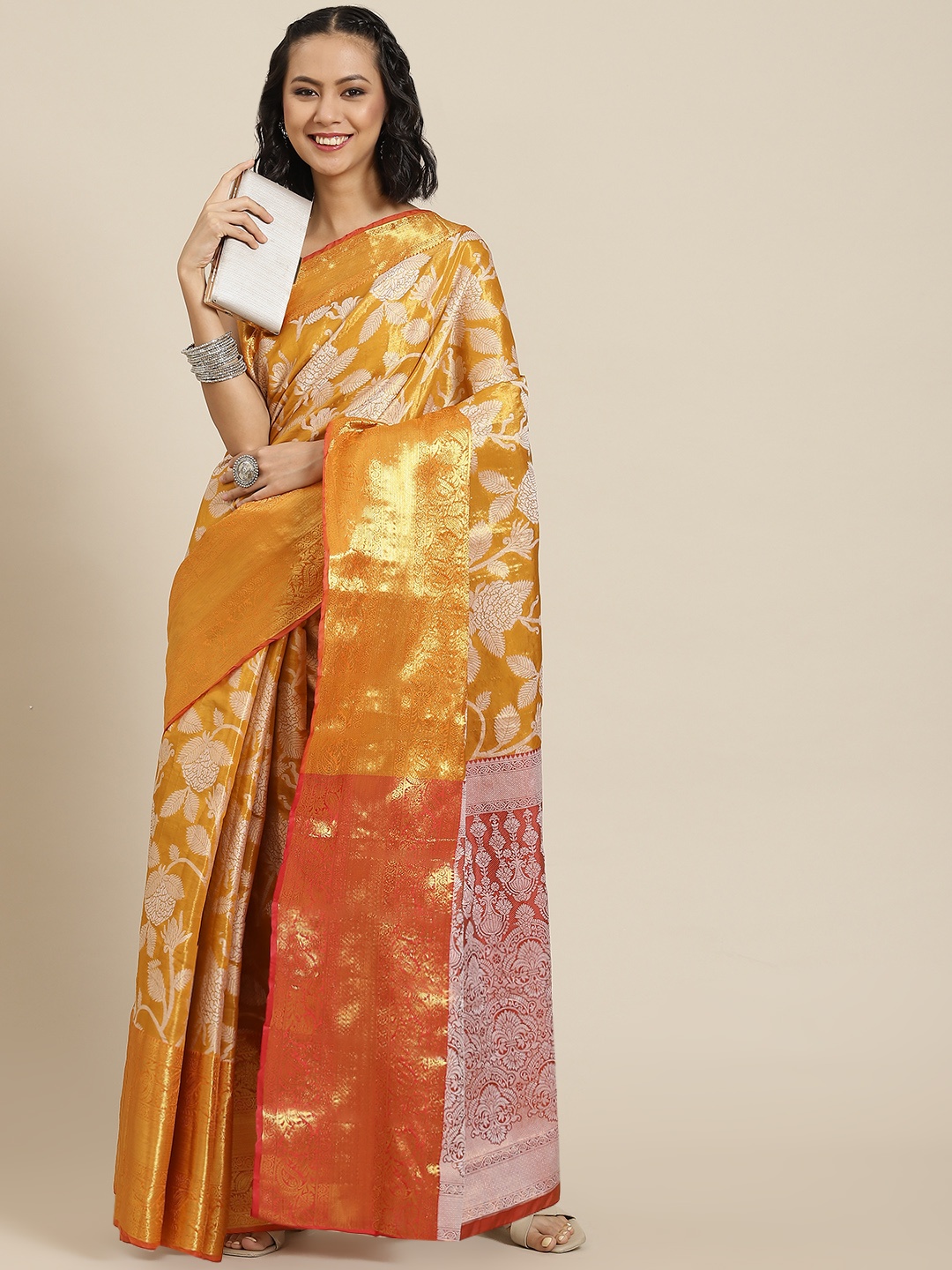 

Silk Land Orange Floral Zari Ikat Saree