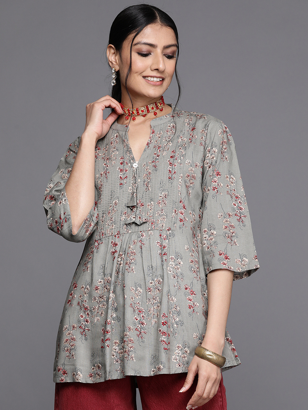 

Libas Grey & Maroon Floral Motifs Printed Pleated Kurti
