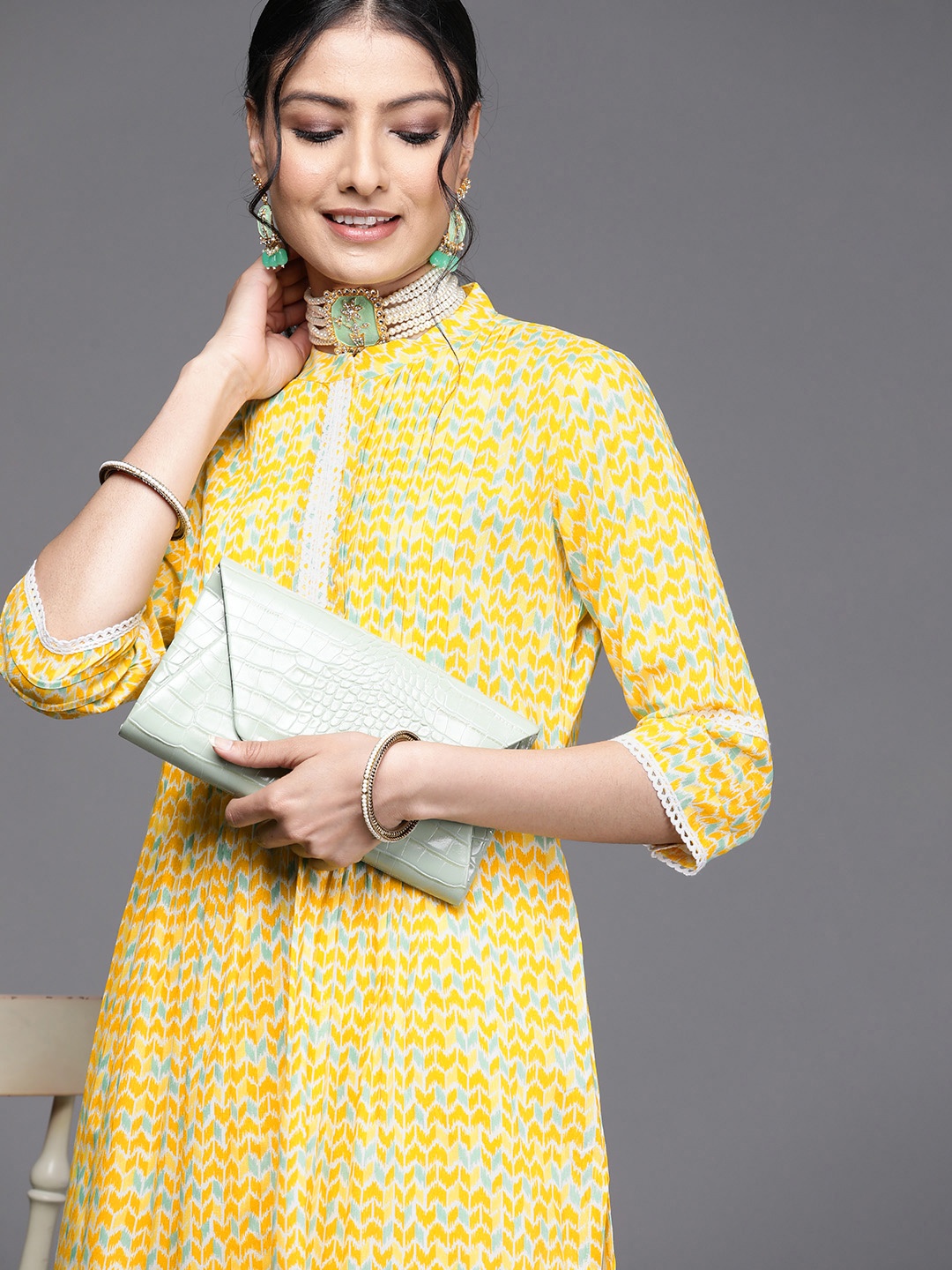 

Libas Women Yellow & Blue Printed Flared Sleeves Kurta