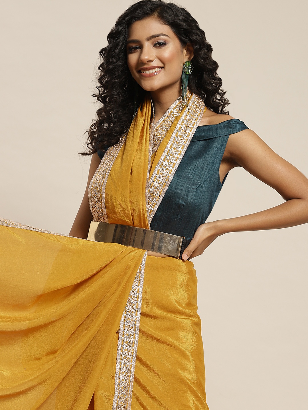 

Sangria Mustard Yellow Solid Embellished Border Saree