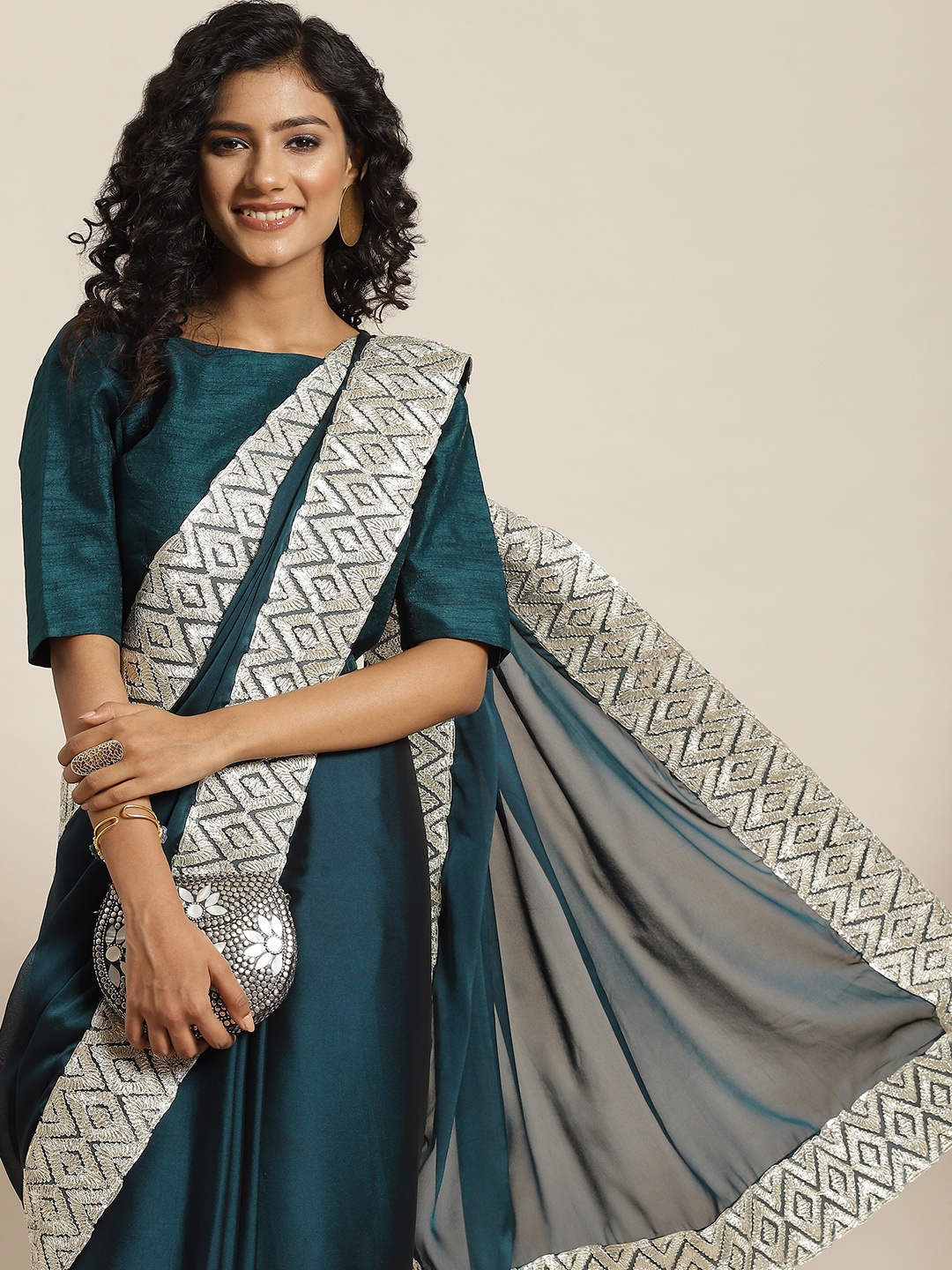

Sangria Teal Blue Solid Gotta Patti Border Saree