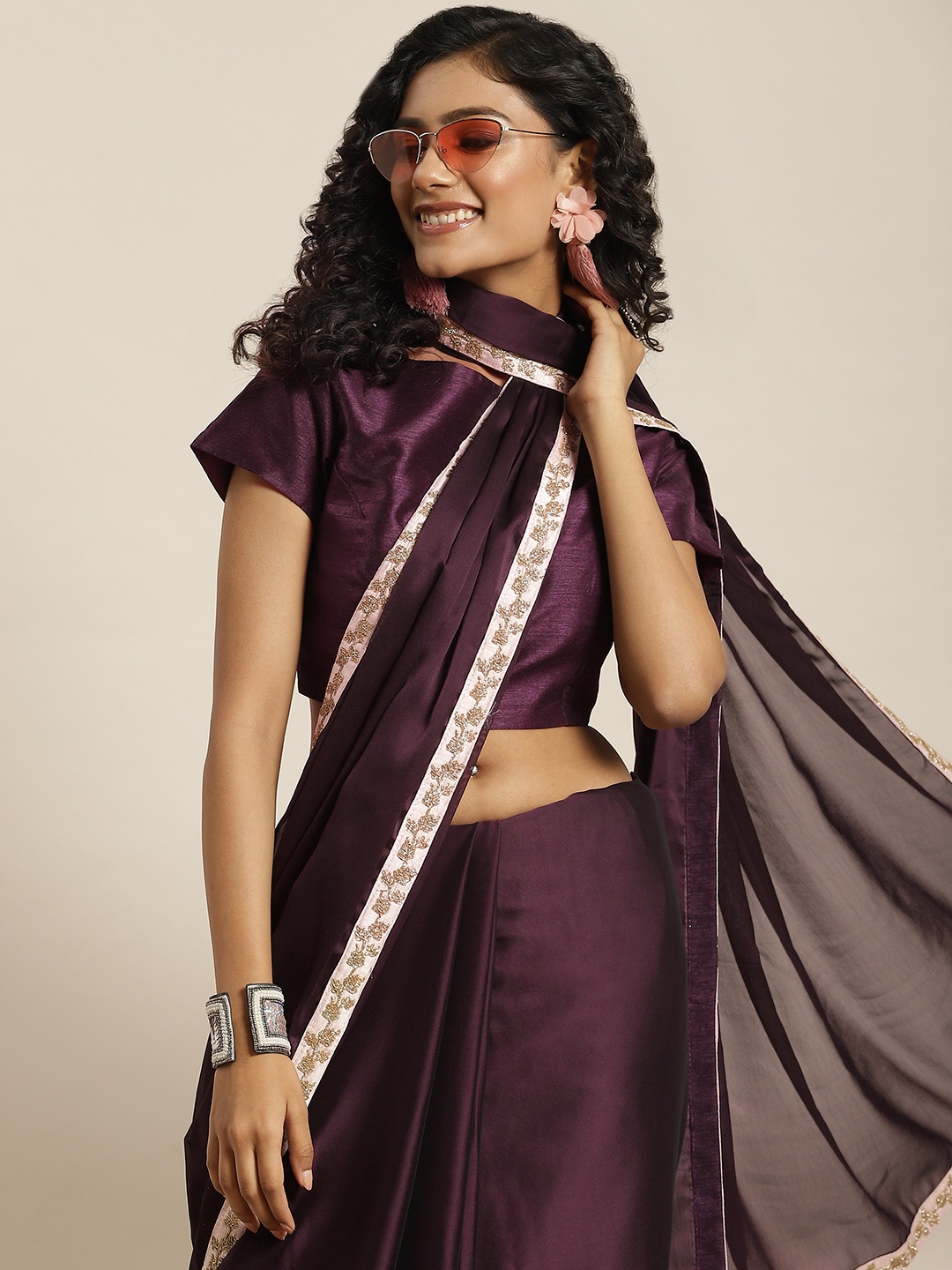 

Sangria Purple Solid Embellished Border Saree