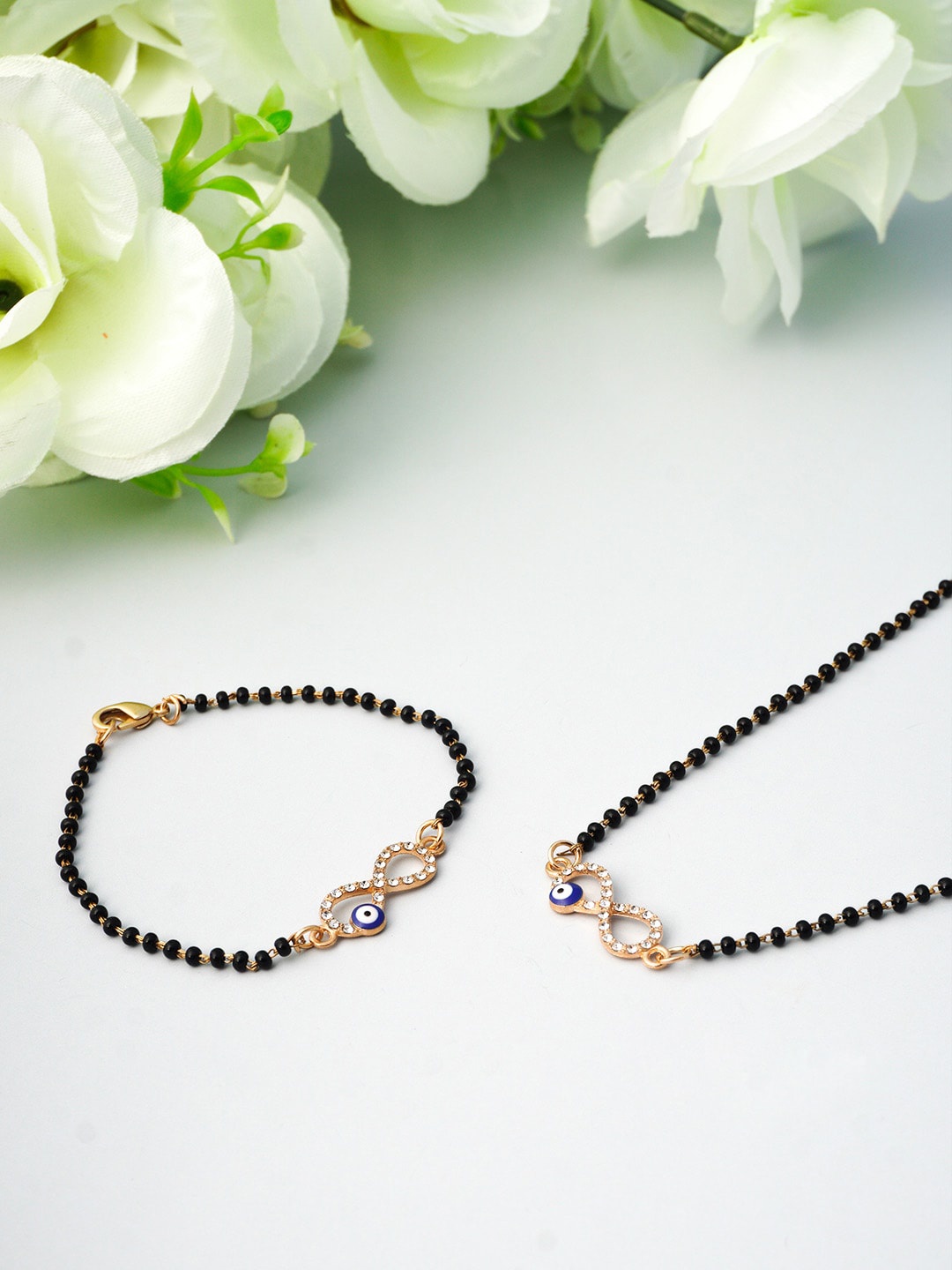 

Ferosh Black & Gold Toned Infinity Evil Eye Mangalsutra Chain & Bracelet Set
