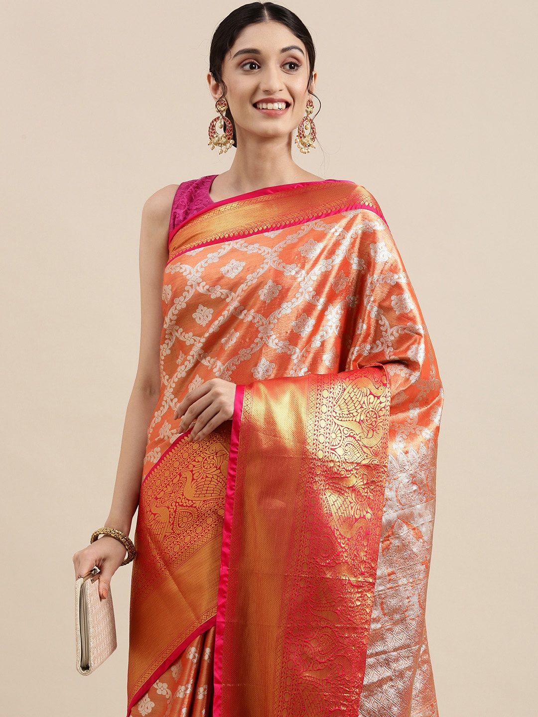 

Mitera Orange & Silver Ethnic Motifs Zari Tissue Celebrity Banarasi Saree