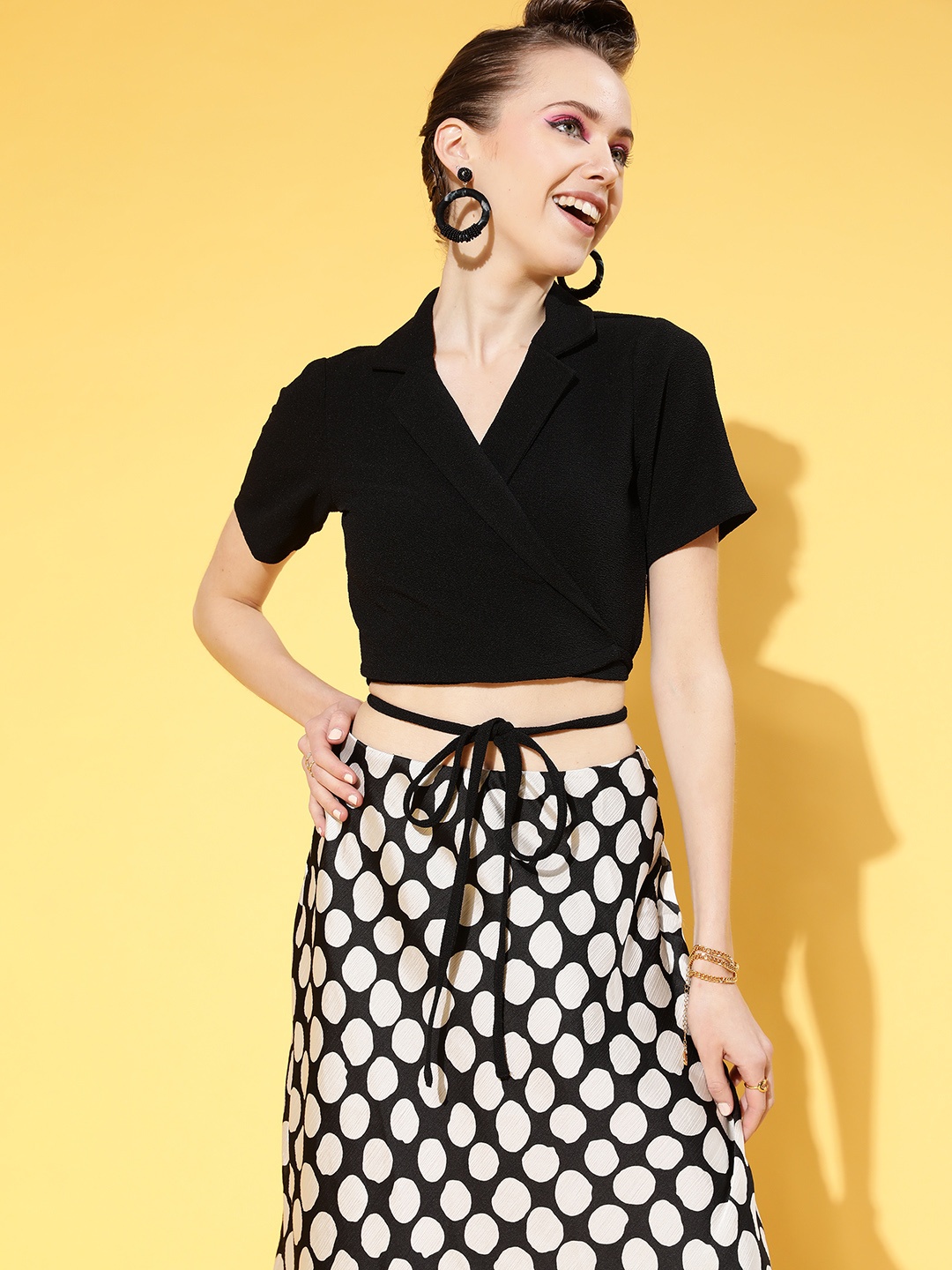 

Athena Women Charming Black Solid Midriff Flossing Top