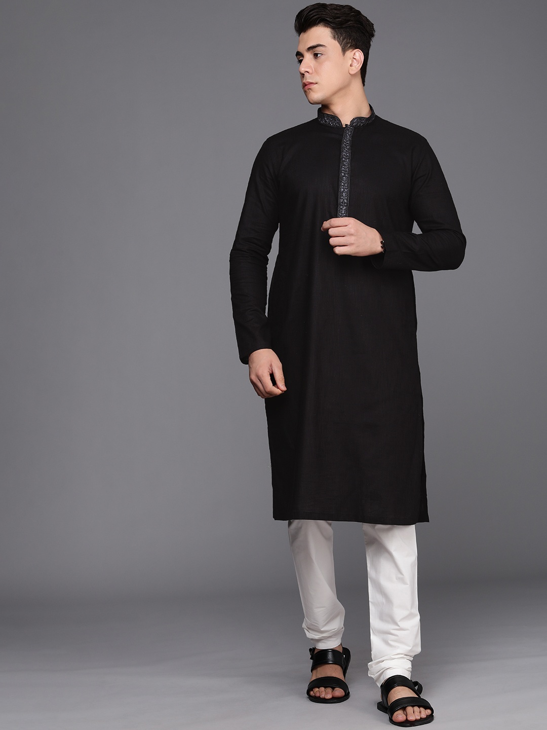 

Manyavar Men Black Self Design Kurta with Churidar