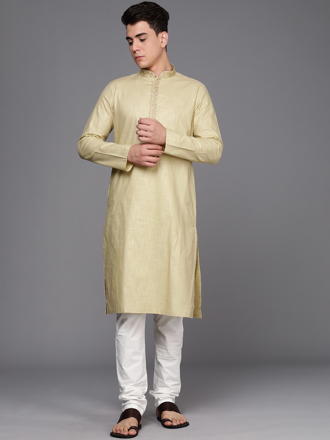 

Manyavar Men Beige Self Design Thread Work Detail Kurta with Churidar