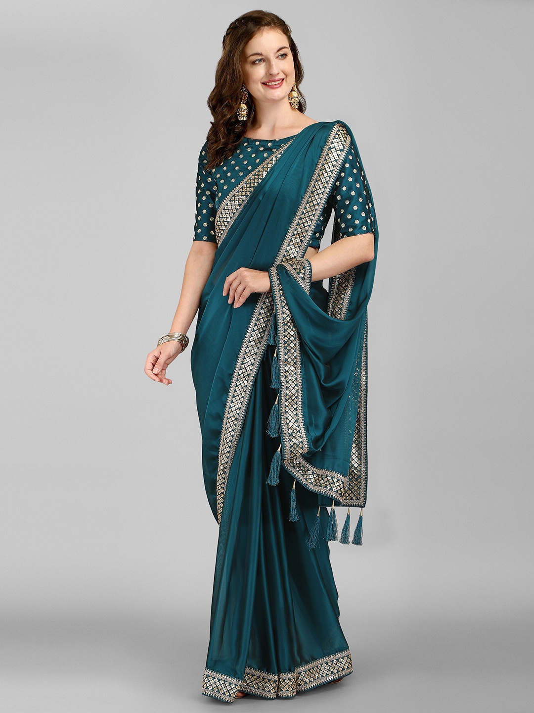 

Iris Teal Sequinned Silk Blend Saree