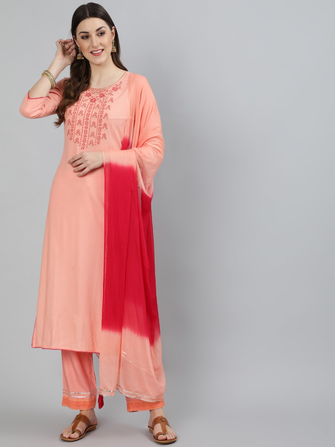 

KIMAYRA Women Peach-Coloured Embroidered Layered Kurta with Trousers & With Dupatta