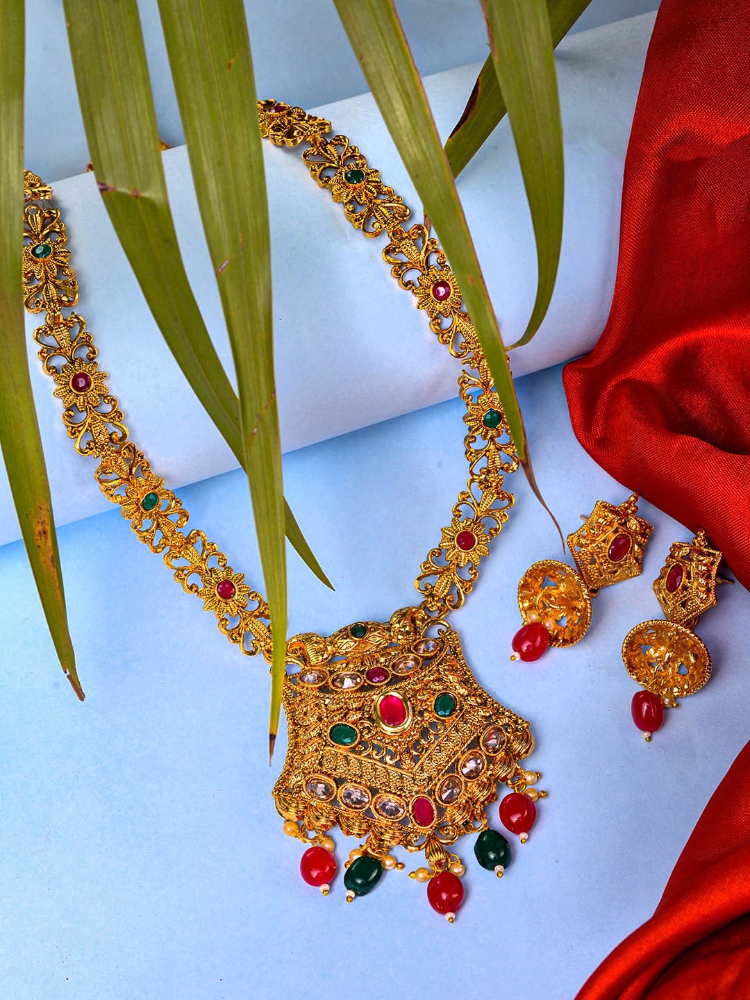 

Saraf RS Jewellery Women Red & Green Gold-Plated Stone Studded Jewellery Set