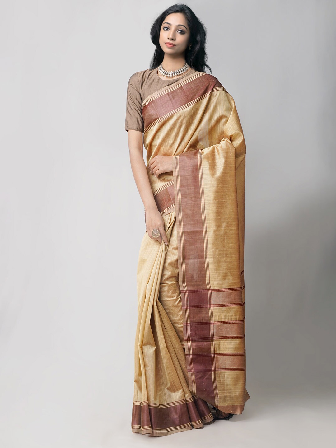 

Unnati Silks Brown & Gold-Toned Art Silk Patola Saree