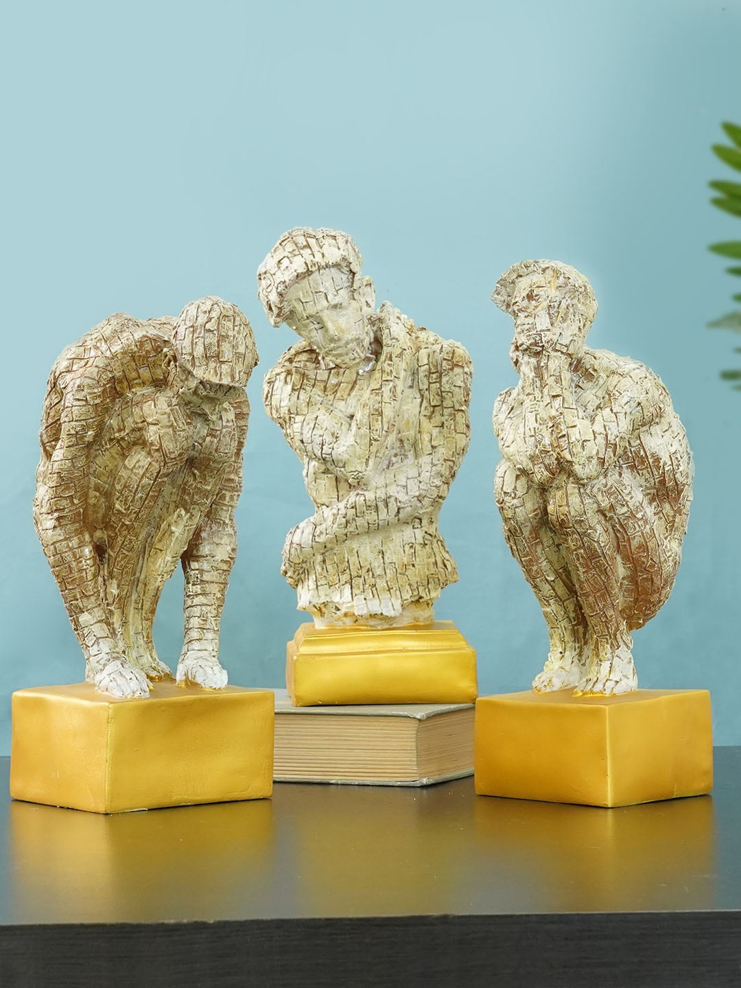 

TIED RIBBONS Set Of 3 Beige & Gold-Toned Man Statue Showpieces