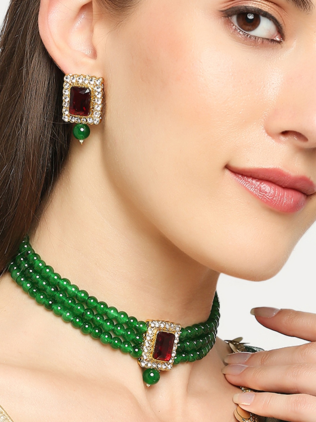 

OOMPH Gold-colored Green And Red Kundan Studded Jewellery Set