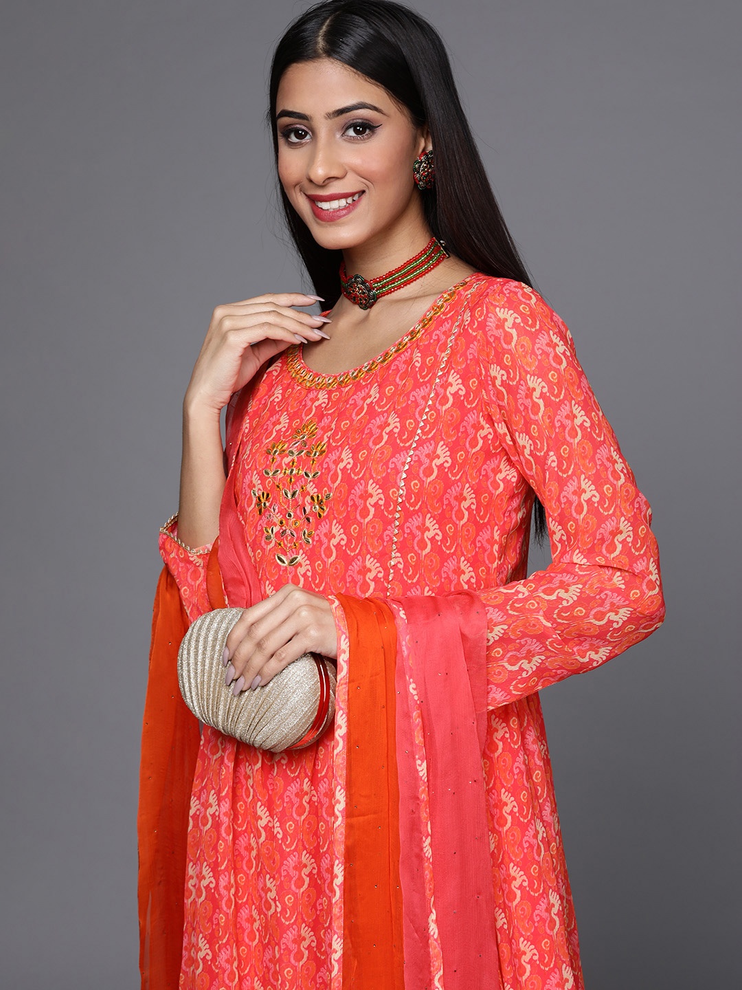 

Libas Women Orange Ethnic Motifs Printed Mirror Work Kurta with Sharara & Dupatta
