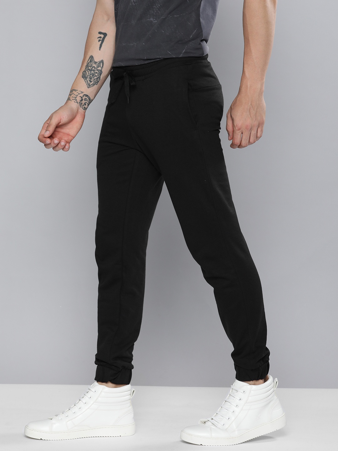 

Mast & Harbour Men Black Solid Joggers with Printed Detail