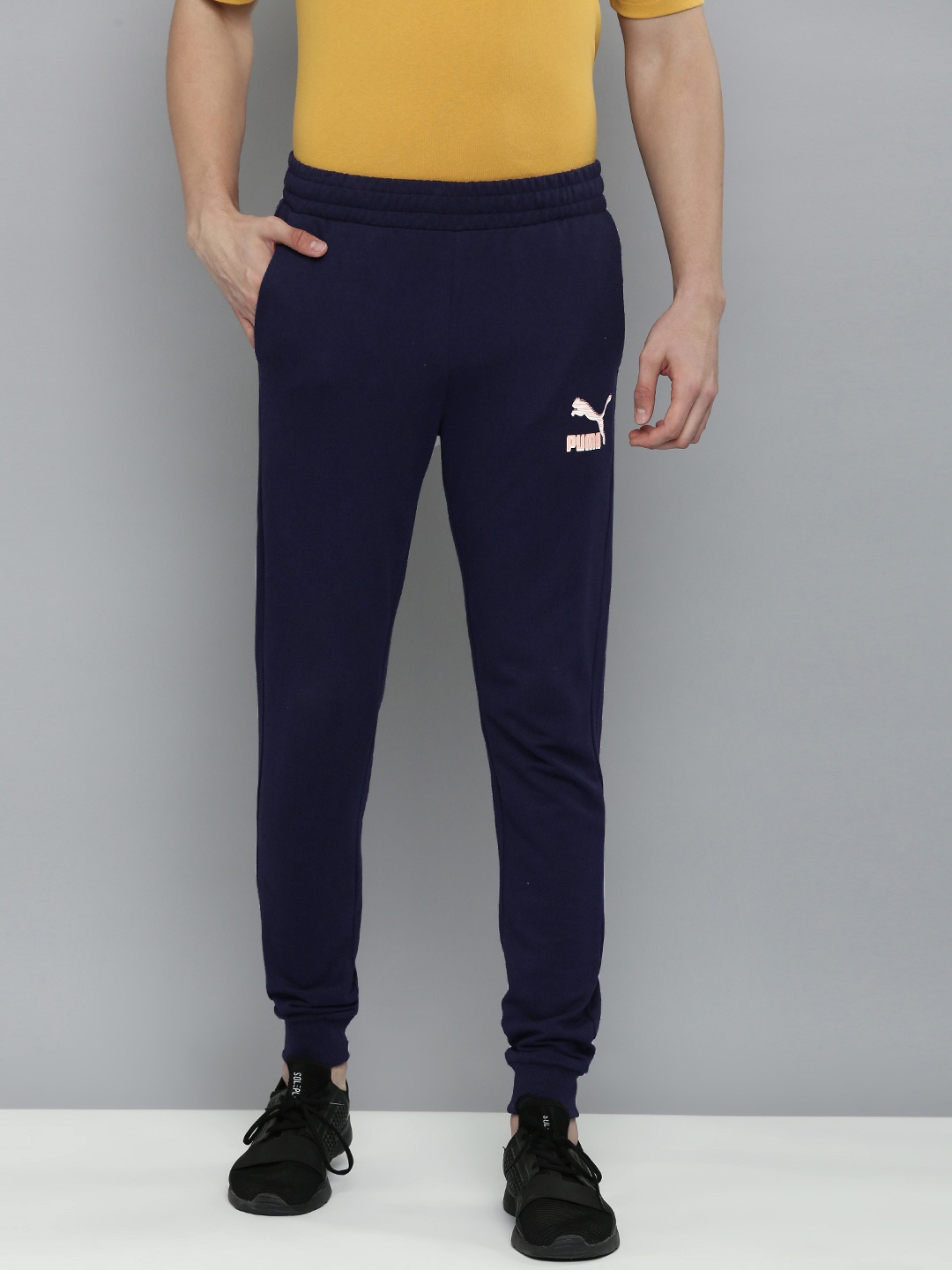 

Puma Men Navy Blue Solid Mid Rise Slim Fit Casual Joggers