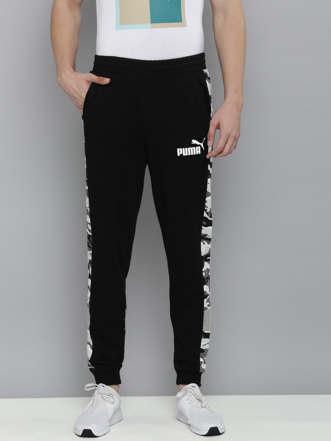 

Puma Men Black Brand Logo Printed Mid-Rise Regular Joggers With Printed Side Stripes