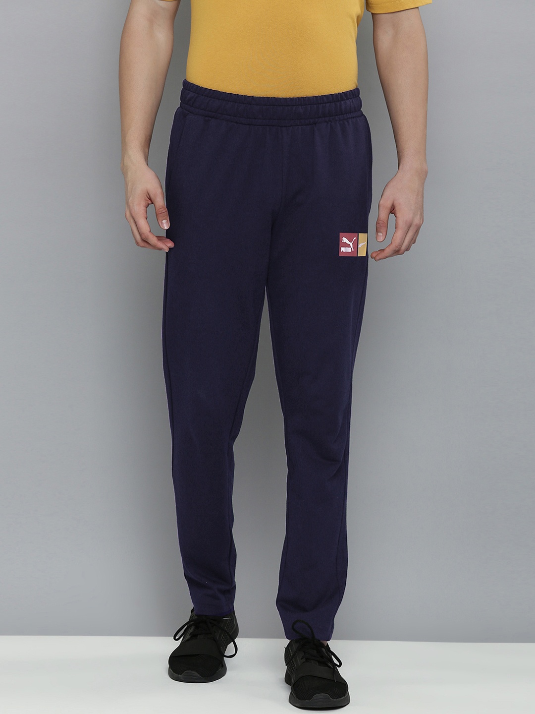 

Puma Men Navy Blue Solid Mid Rise Casual Track Pants