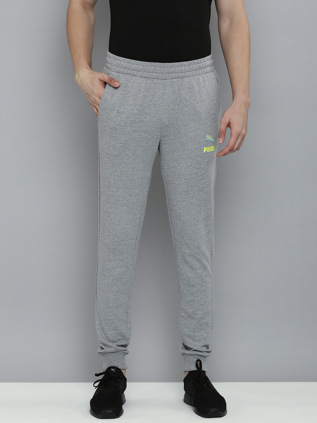 

Puma Men Solid Slim Fit Mid Rise Casual Joggers, Grey