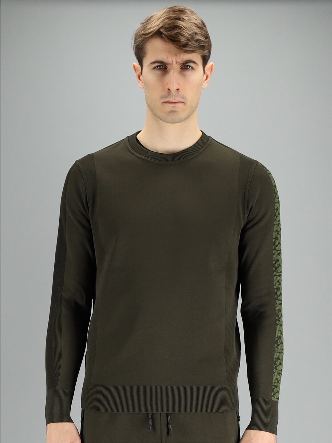 

FREESOUL Men Green Solid Sweatshirt