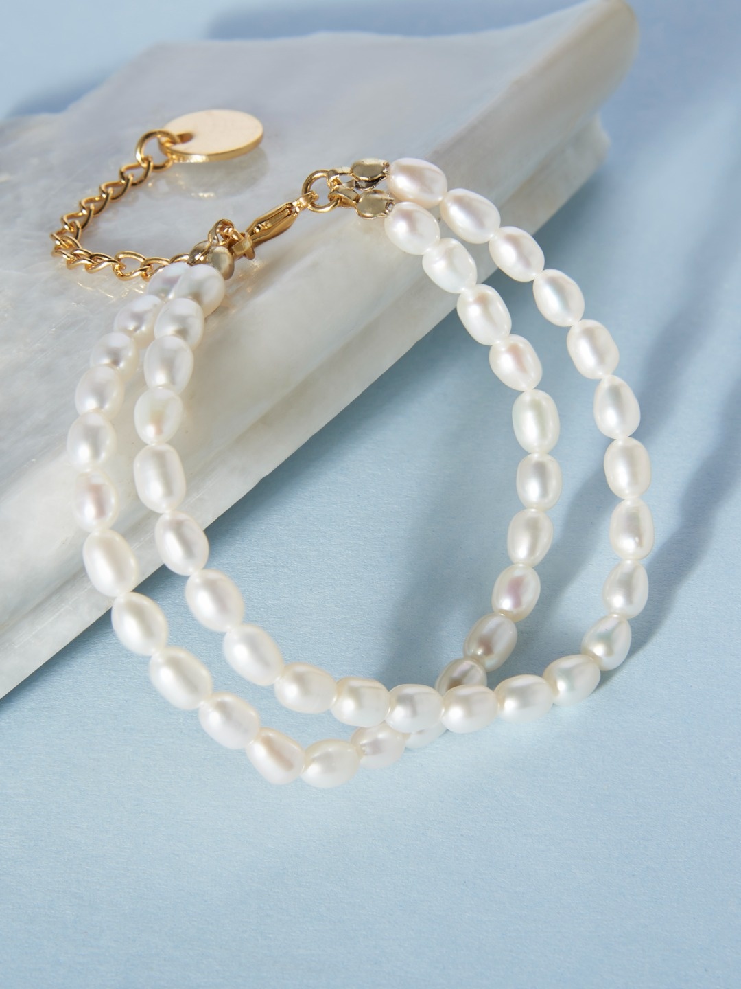 

Zaveri Pearls Women Gold-Toned & White Freshwater Natural Pearls Multistrand Bracelet