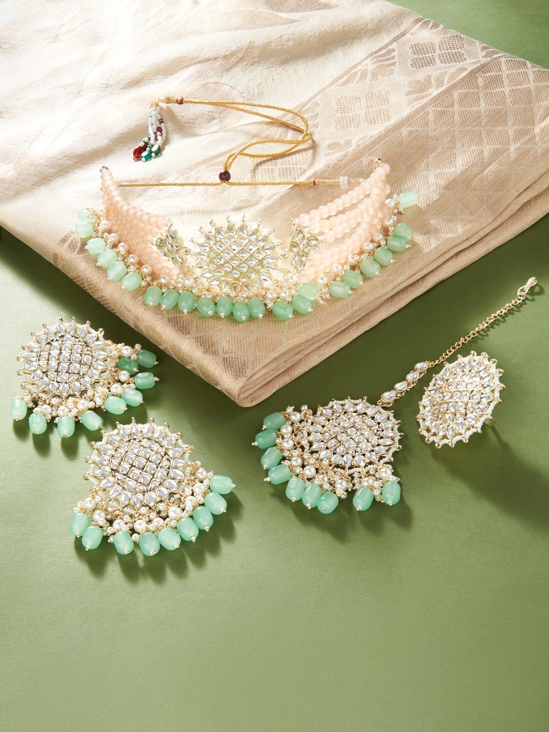 

Zaveri Pearls Gold-Plated Peach & Green Kundan Studded Jewellery Set