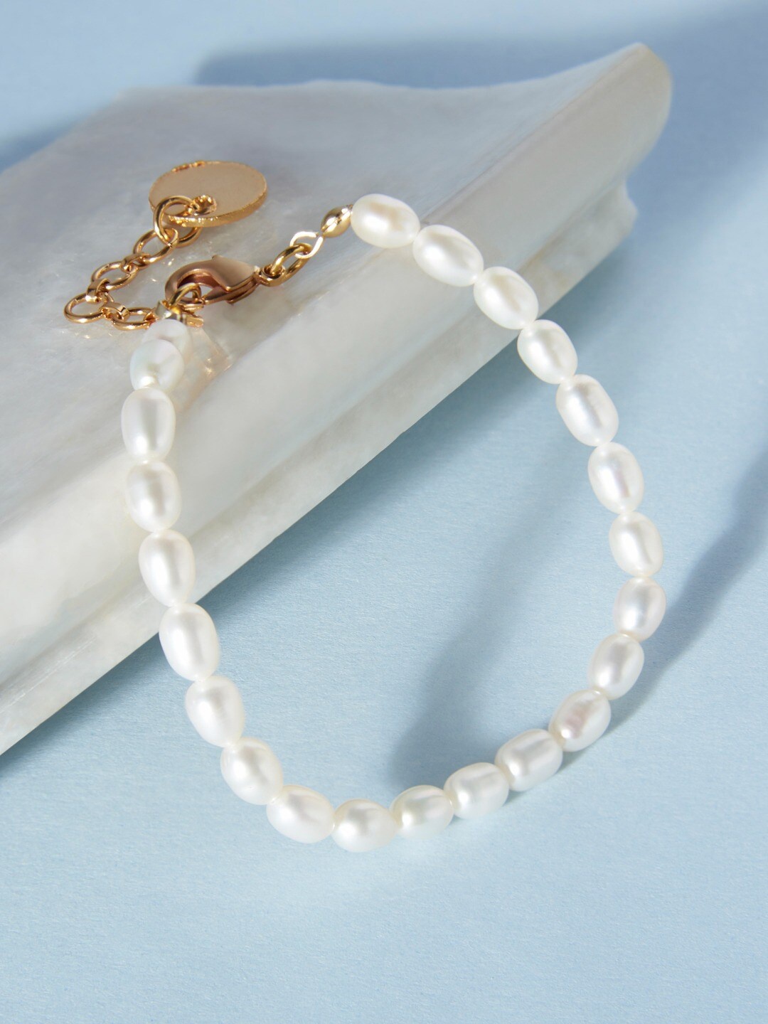 

Zaveri Pearls White Freshwater Natural AAA+ Rice Pearl Single Strand Bracelet