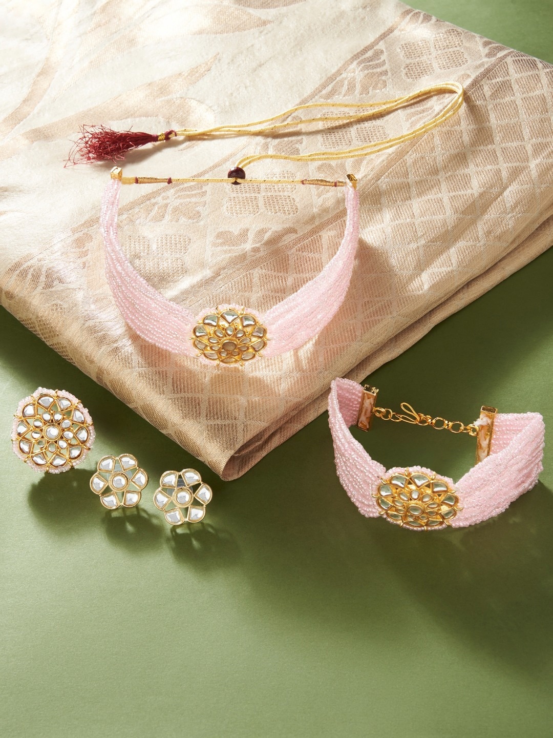 

Zaveri Pearls Gold-Plated & Pink Stone-Studded & Beaded Jewellery Set