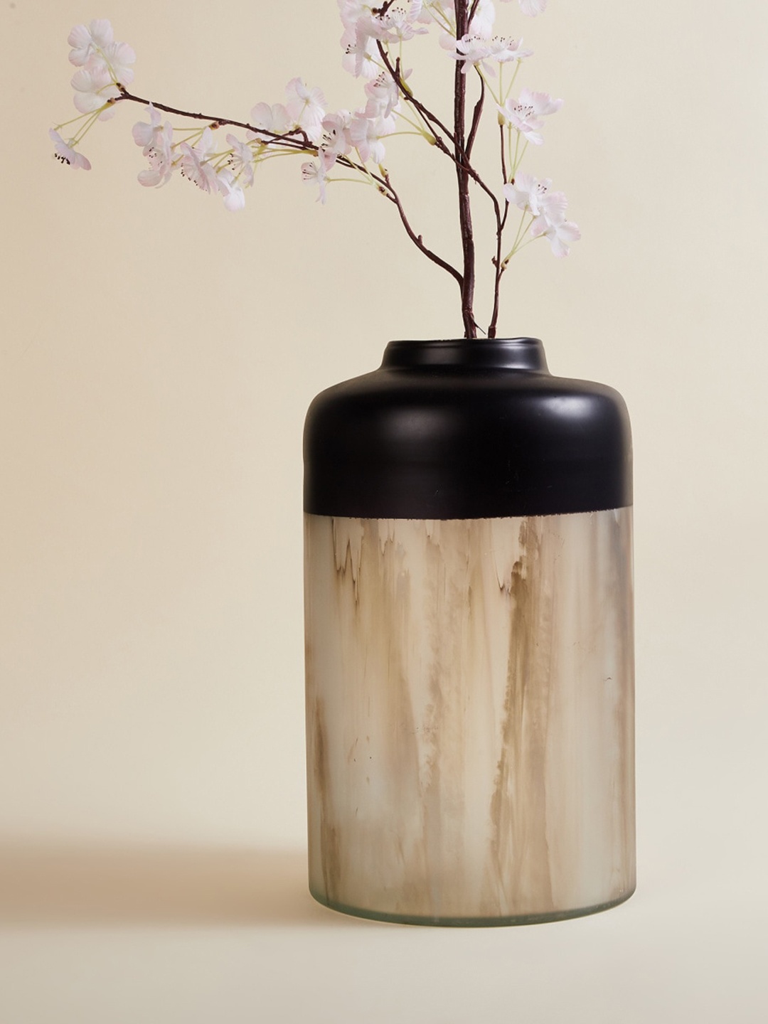 

Home Centre Black & Beige Solid Cylindrical Metal Vase