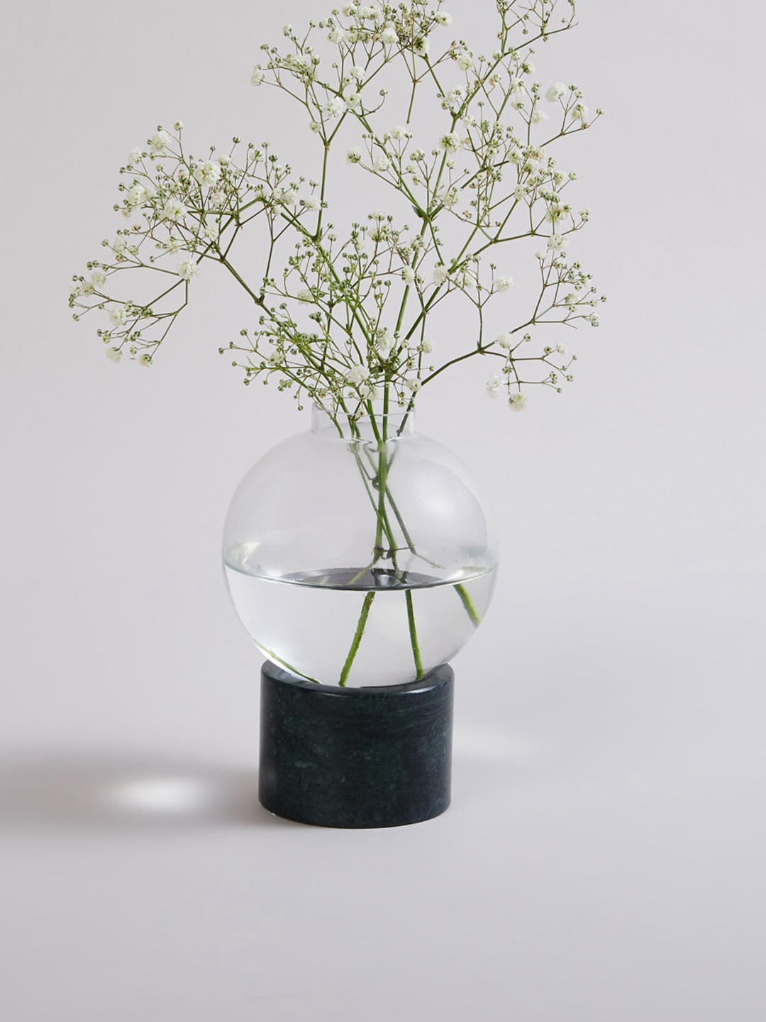 

Home Centre Black Ceramic Stand & Solid Glass Vase