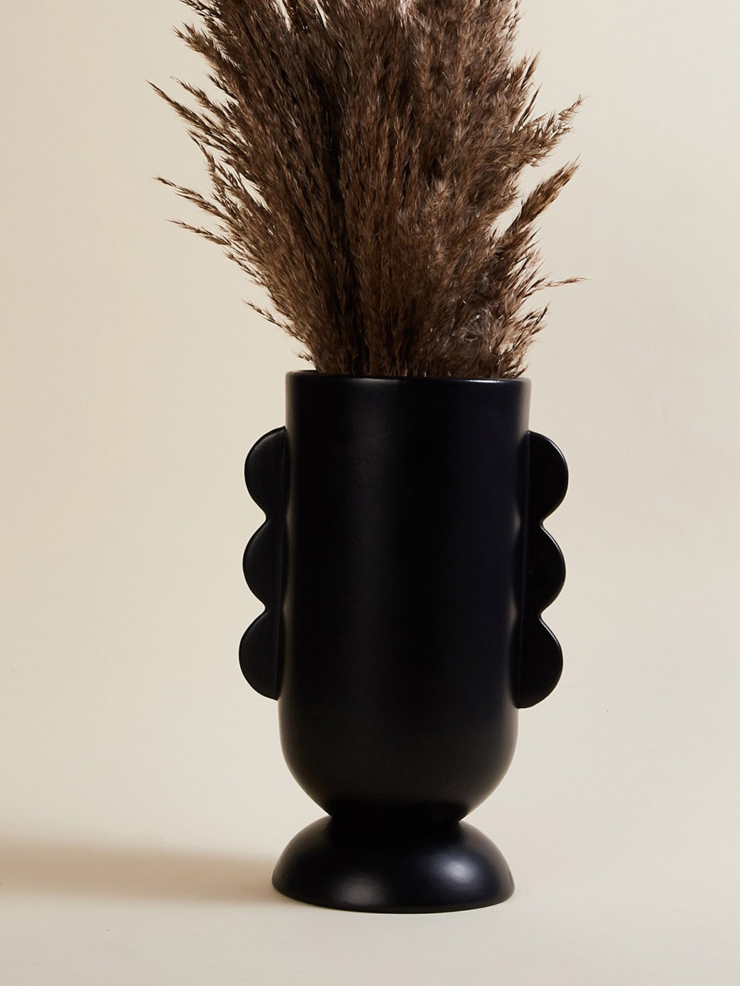 

Home Centre Black Solid Triple Ear Ceramic Vase