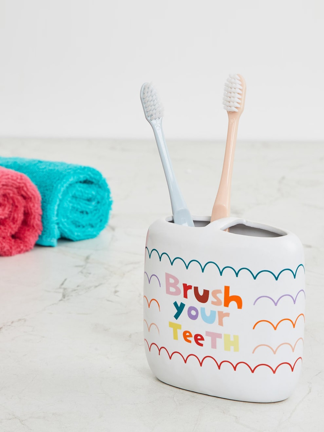 

Home Centre White & Blue Printed Ceramic Toothbrush Holder