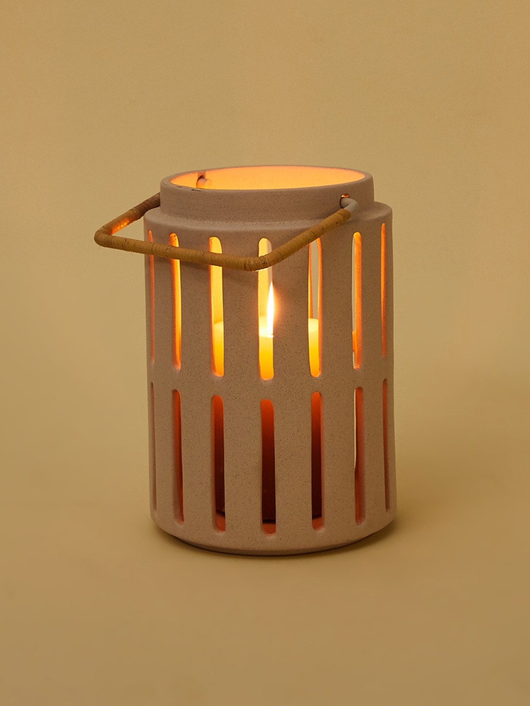 

Home Centre Beige Solid Ceramic Candle Holder