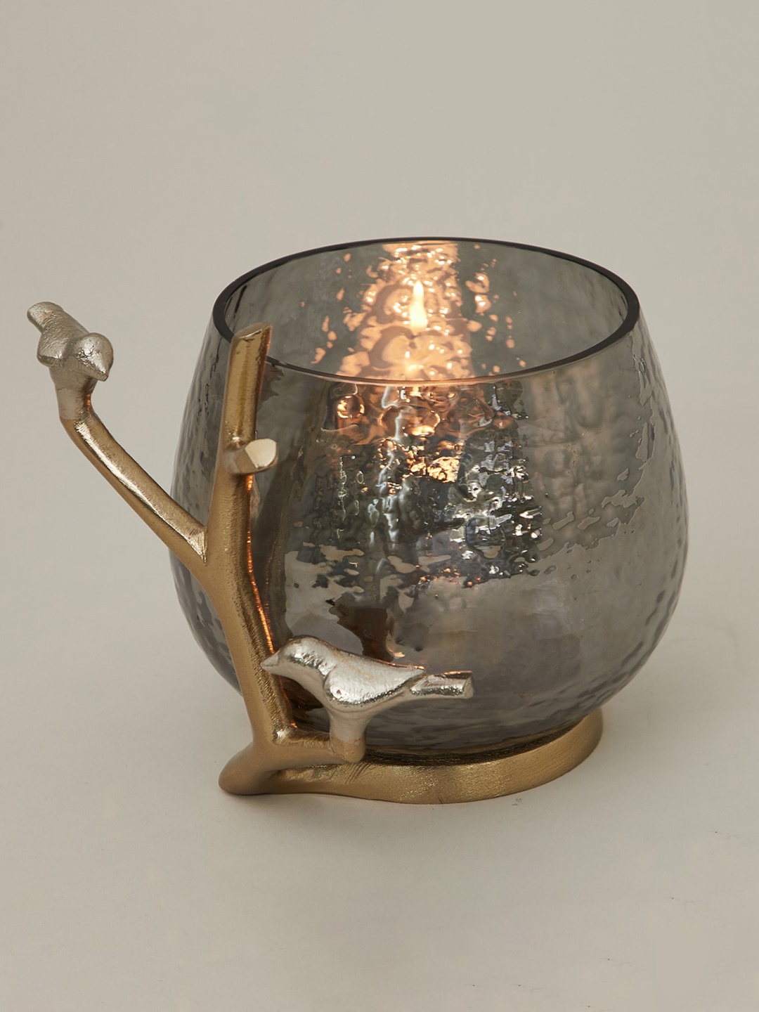 

Home Centre Silver & Gold Toned Textured Glass Nickle Bird And Branch Votive Holder
