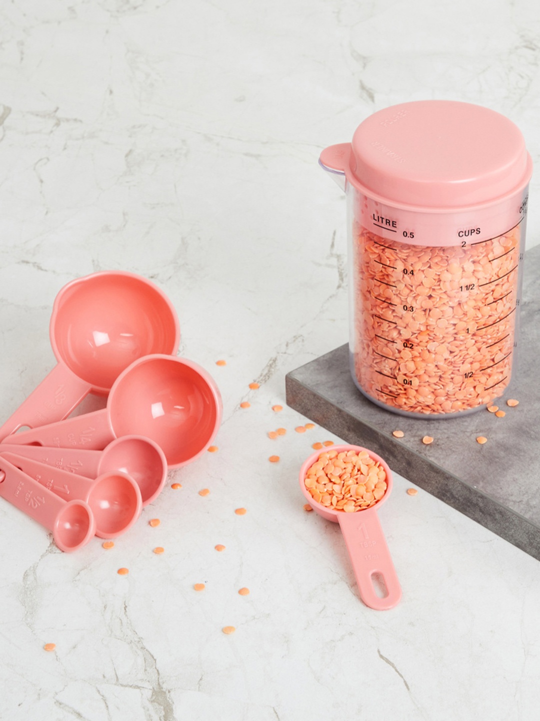

Home Centre Pink Solid Measuring Spoon Set With Storage Jar